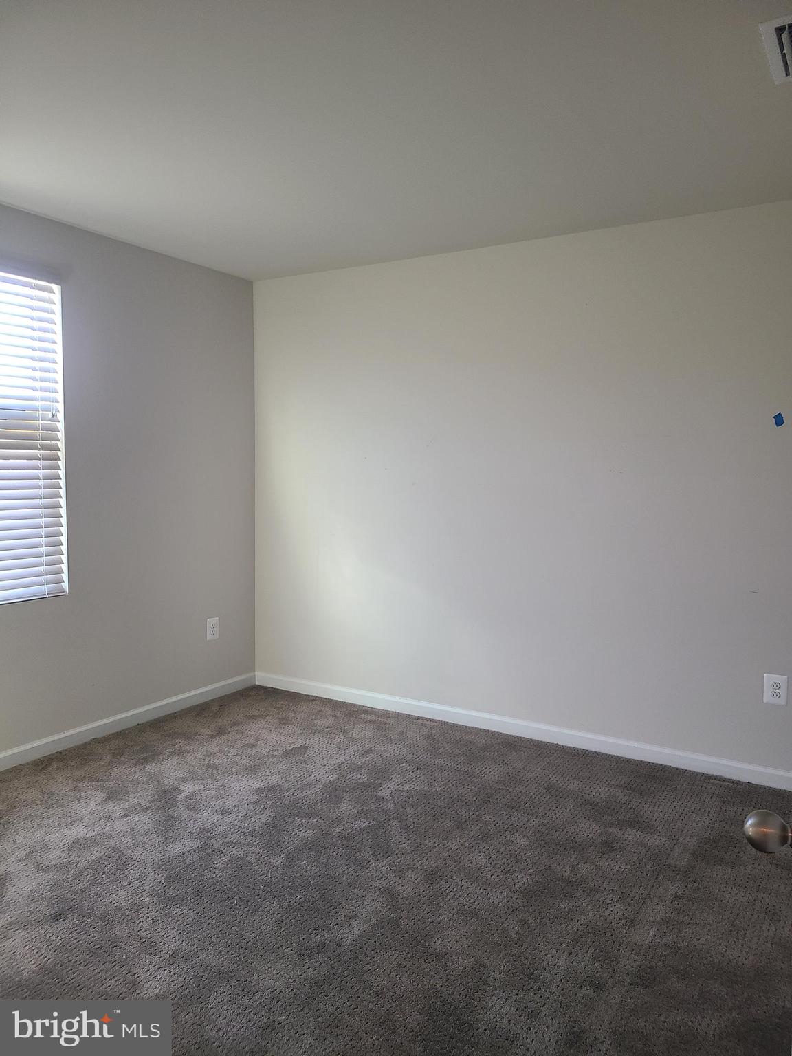 105 Mariners Way Cambridge, MD 21613 - Photo 10 of 45 an empty room with a window