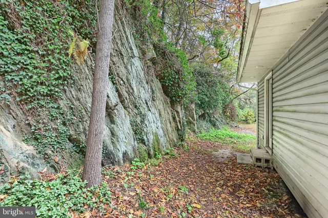 a kitchen with a sink cabinets stainless steel appliances and a counter top space