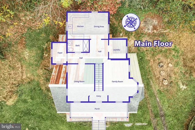 an empty room with chandelier fan and windows