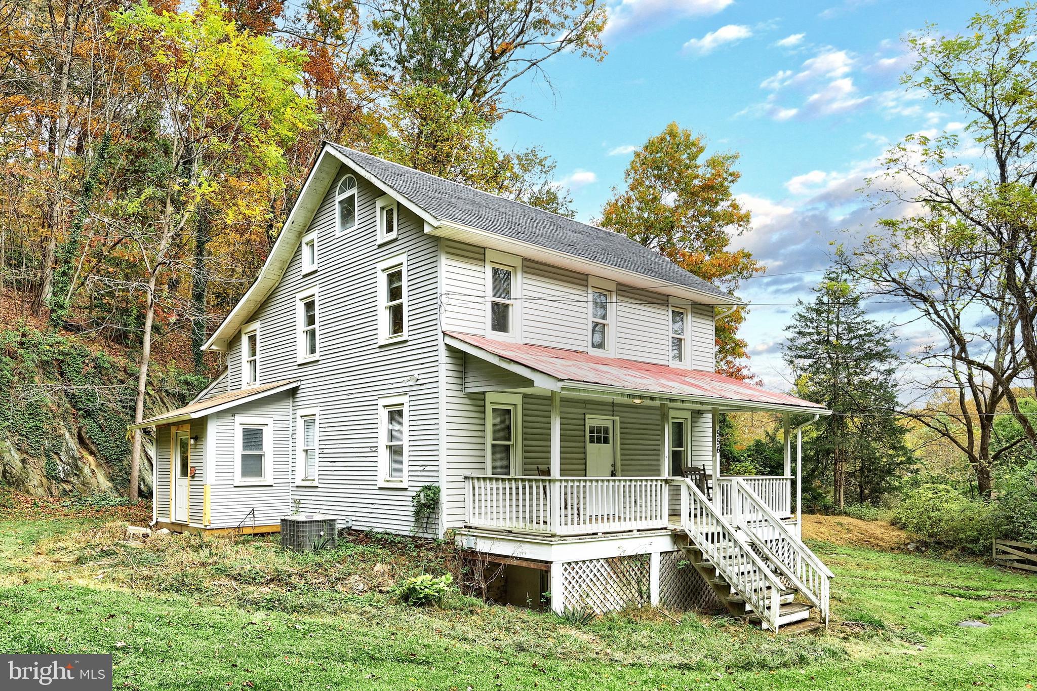 556 Bair Road Delta, PA 17314 - Photo 3 of 48 a front view of a house with a yard table and chairs