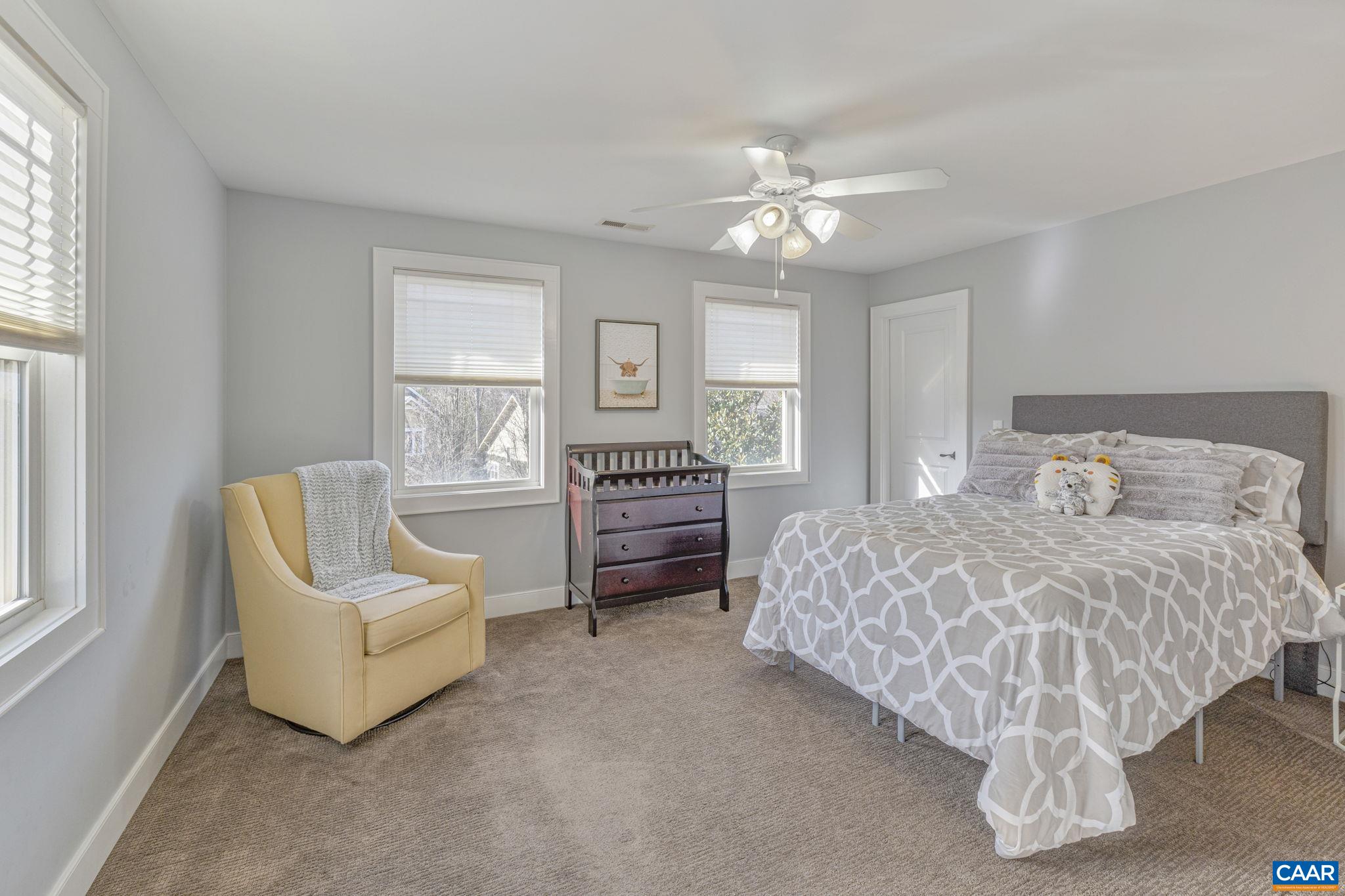 811 Village Road Charlottesville, VA 22903 - Photo 37 of 66 a bed room with a bed and a couch