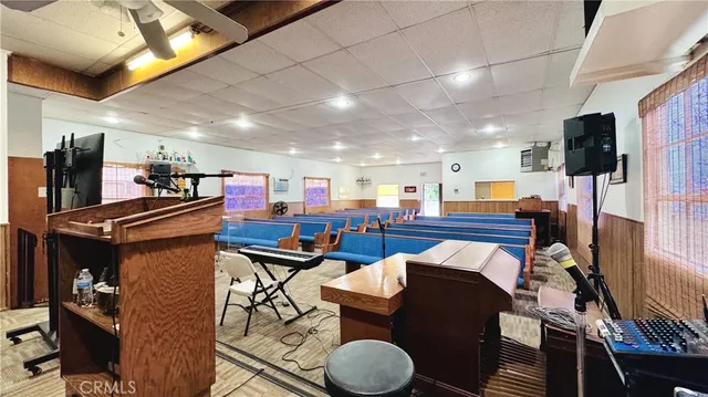 a kitchen with stainless steel appliances kitchen island granite countertop a refrigerator and a stove