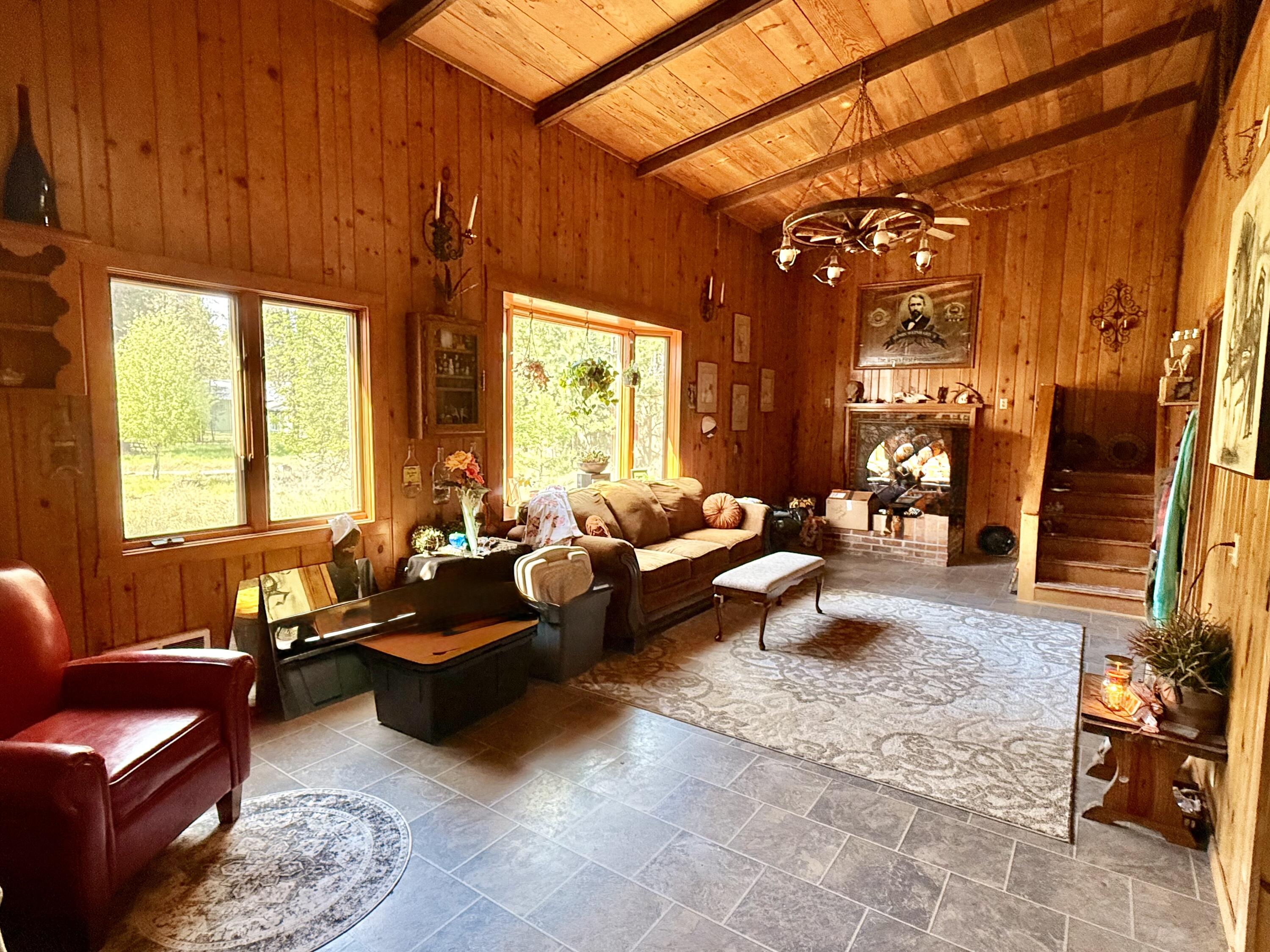 16025 Strawn Road La Pine, OR 97739 - Photo 11 of 70 a living room with furniture and a fireplace