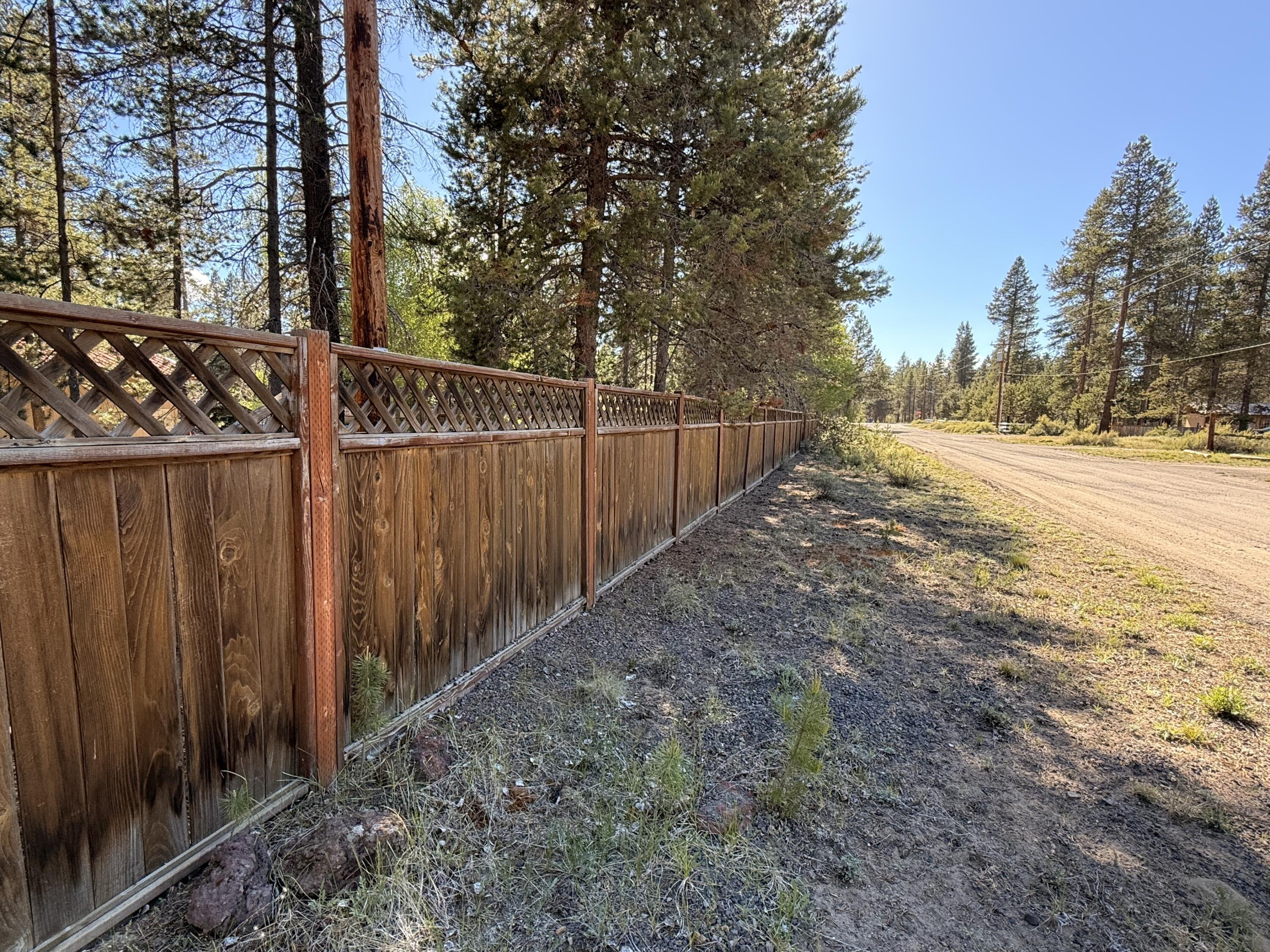 16025 Strawn Road La Pine, OR 97739 - Photo 70 of 70 a view of a backyard with wooden fence and trees