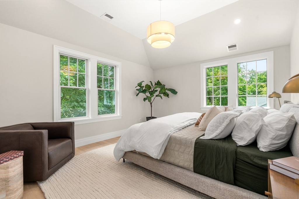 28 Parker Road Wellesley, MA 02482 - Photo 19 of 32 a bedroom with a bed and a couch
