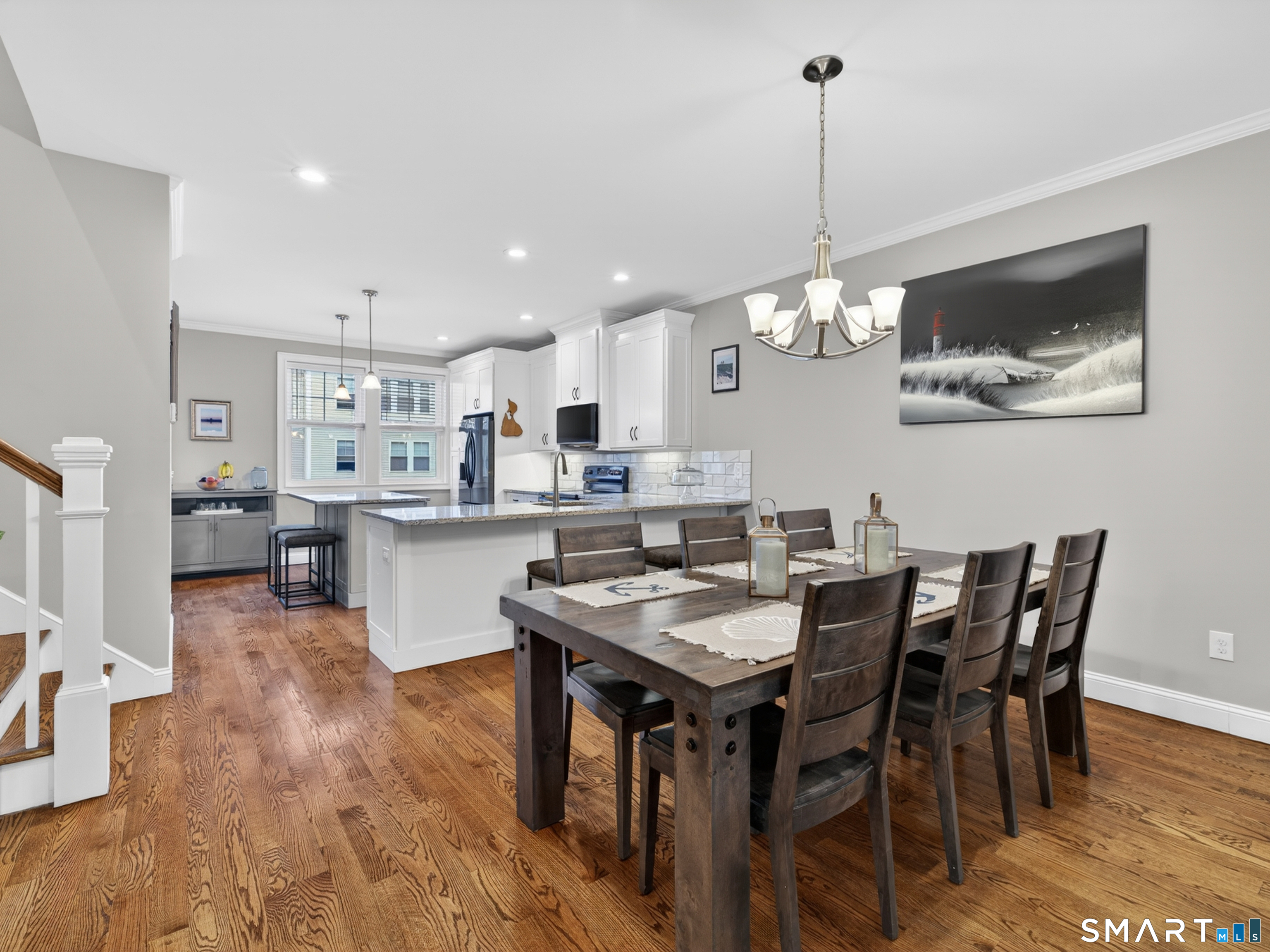 34 Village Crossing, Unit 34 Niantic, CT 06357 - Photo 13 of 38 a dining room with stainless steel appliances kitchen island a table and chairs