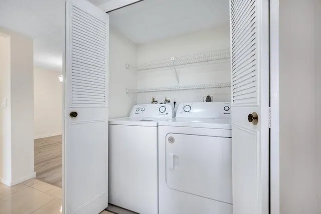 a utility room with dryer and washer