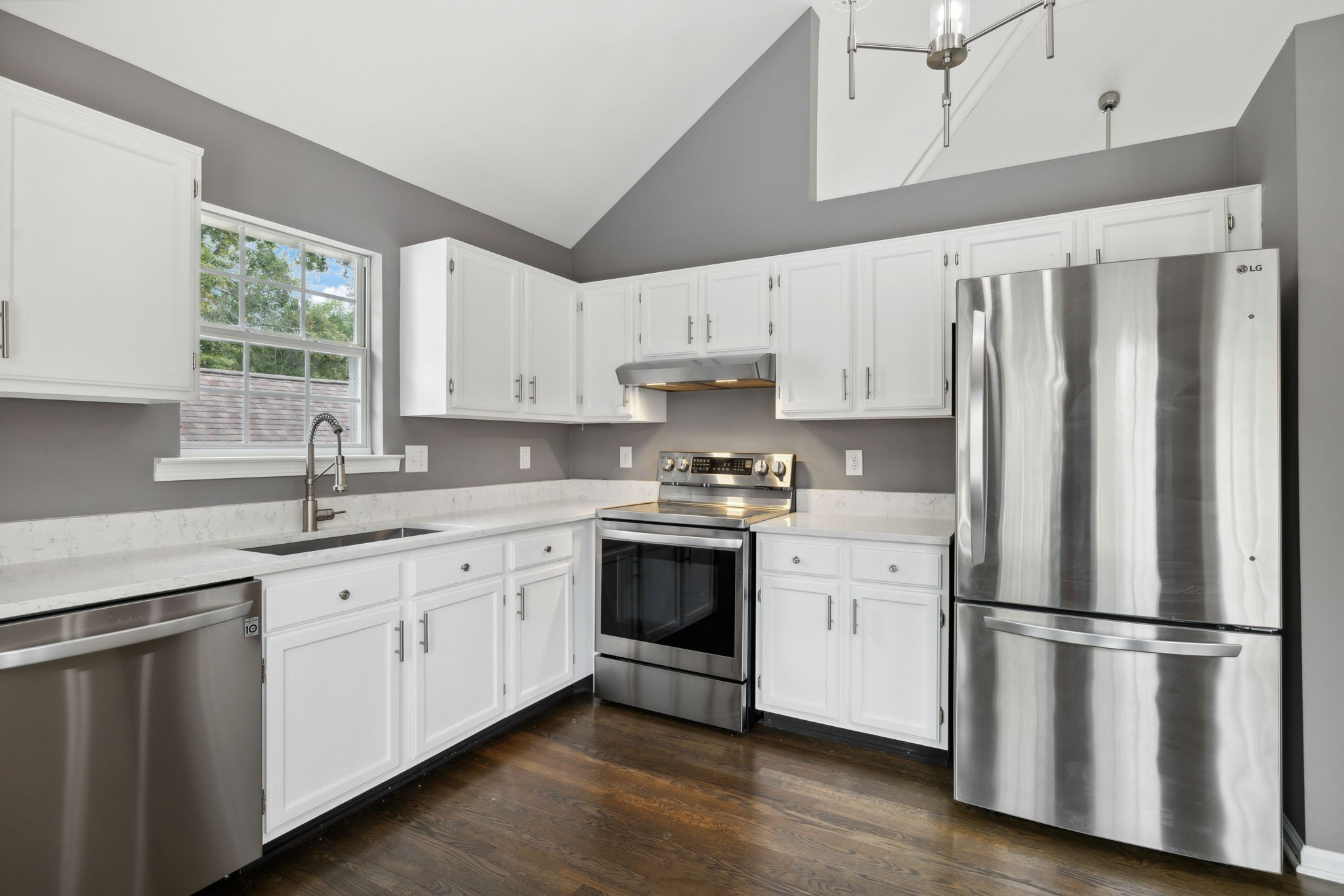 3014 Bent Tree Road Franklin, TN 37067 - Photo 9 of 28 a kitchen with stainless steel appliances white cabinets and a refrigerator