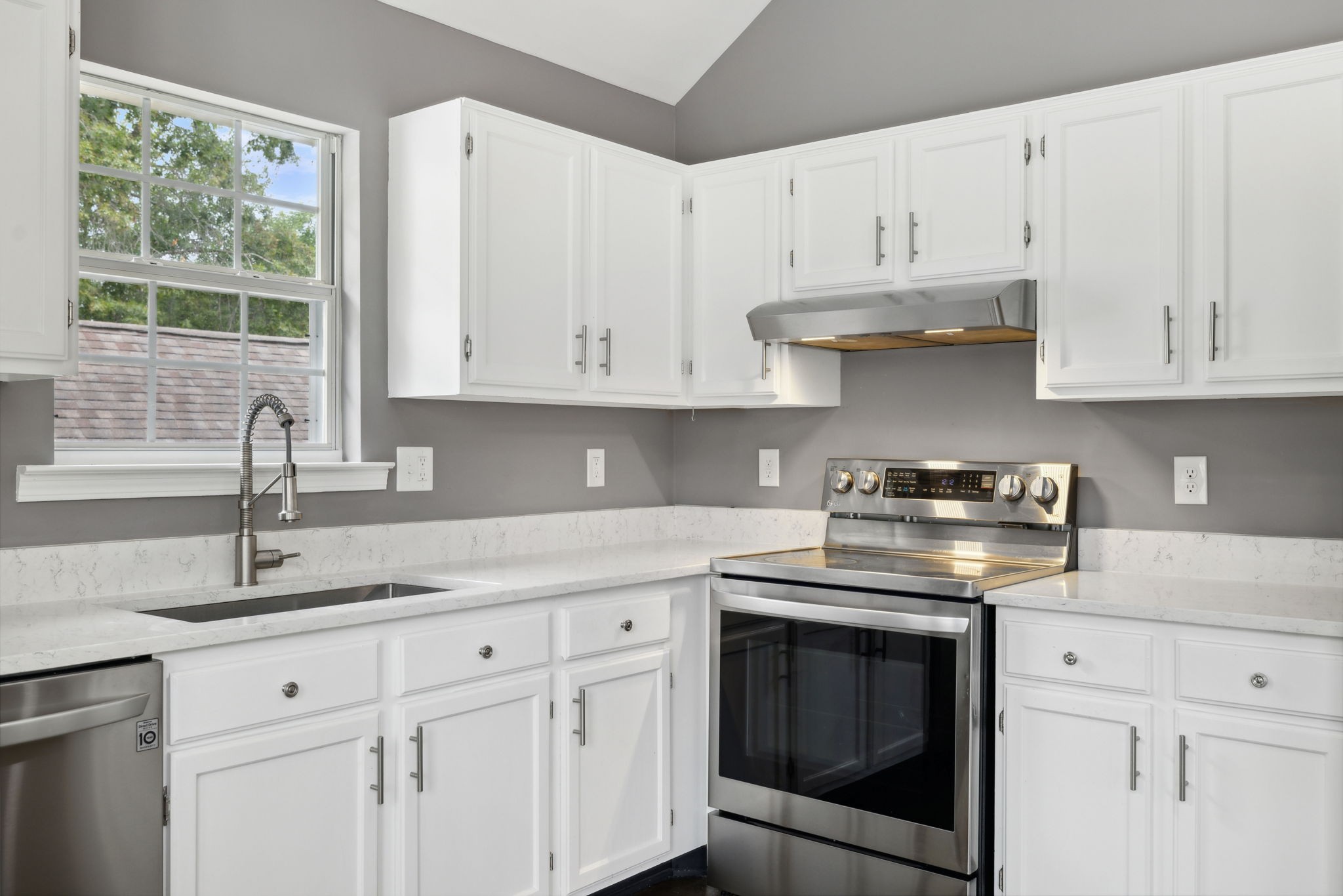 3014 Bent Tree Road Franklin, TN 37067 - Photo 10 of 28 a kitchen with granite countertop white cabinets and a stove