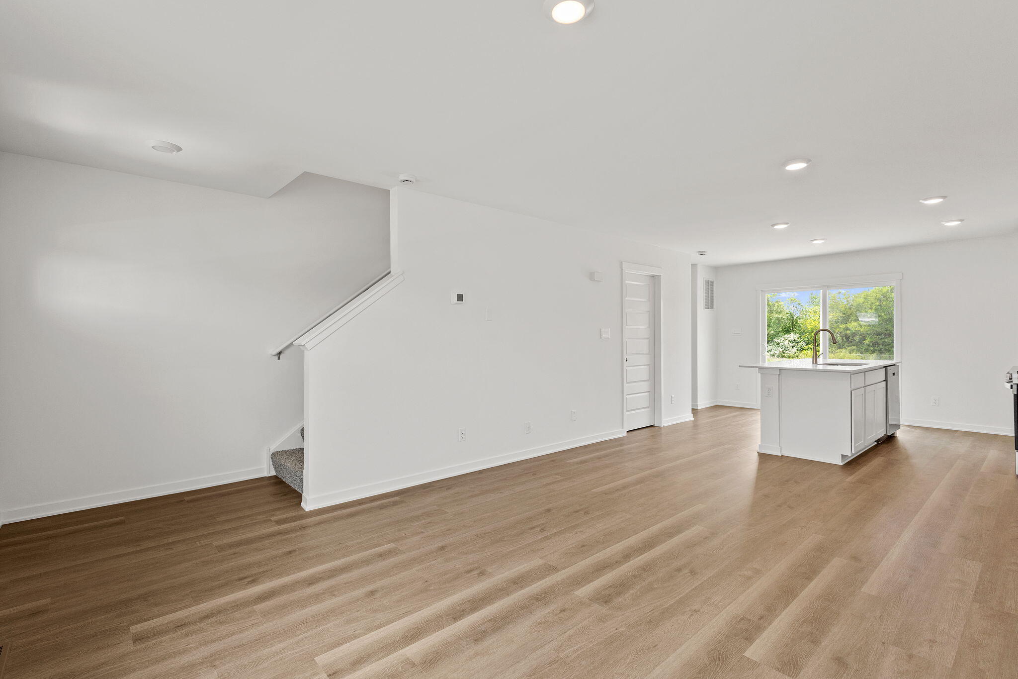 594 Petry Street Hebron, IN 46341 - Photo 7 of 18 a view of an empty room with wooden floor and a window