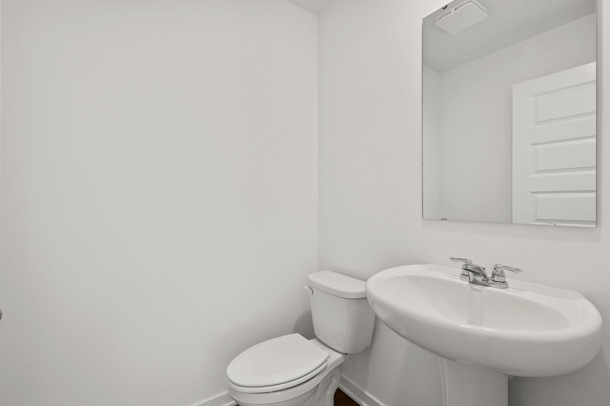 594 Petry Street Hebron, IN 46341 - Photo 8 of 18 a bathroom with a sink a toilet and mirror
