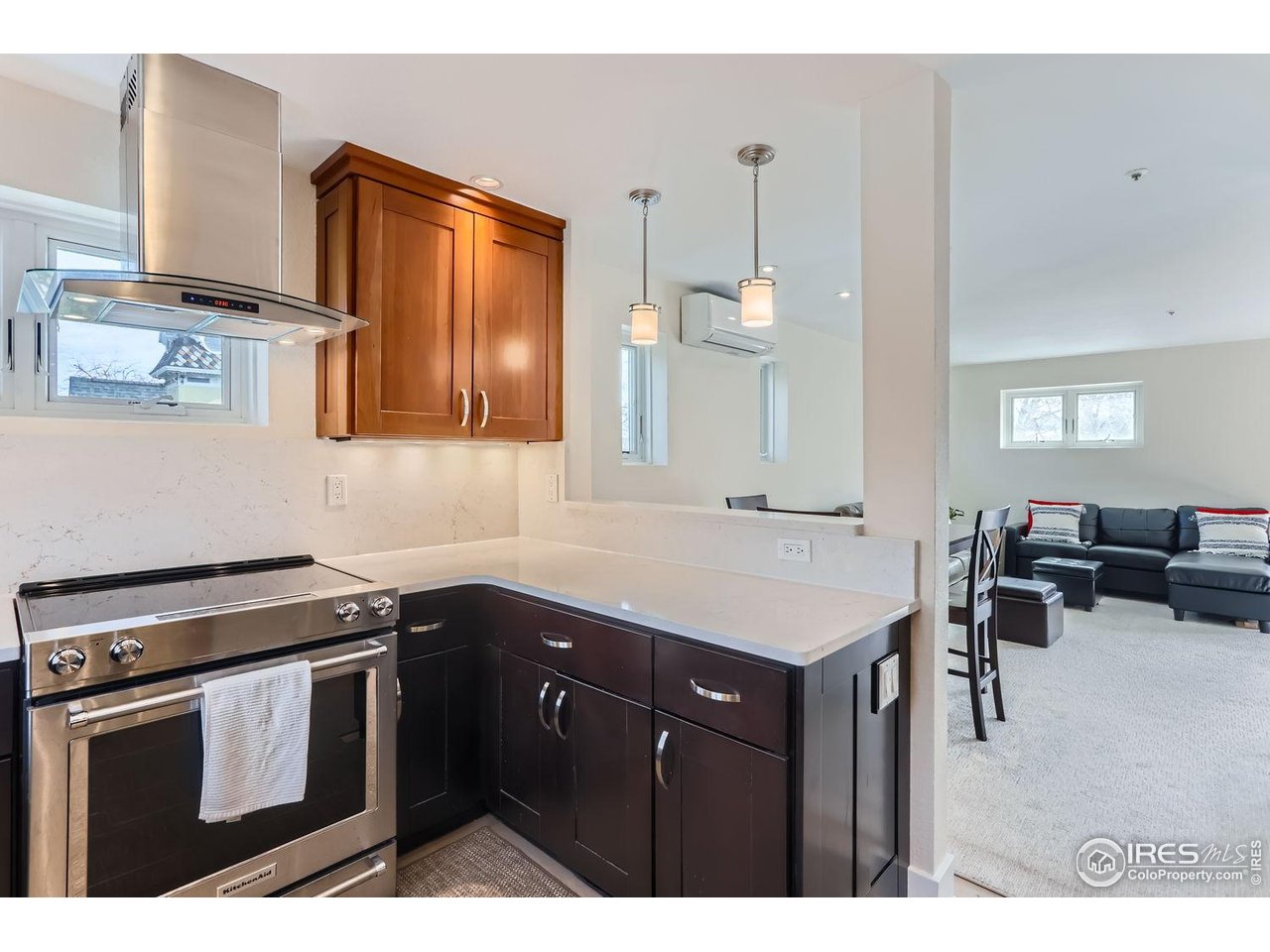 620 Pearl Street, Unit E Boulder, CO 80302 - Photo 1 of 37 a kitchen with a sink a stove a dining table and chairs