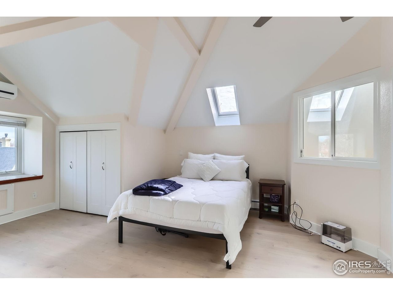 620 Pearl Street, Unit E Boulder, CO 80302 - Photo 16 of 37 a bedroom with a bed and window