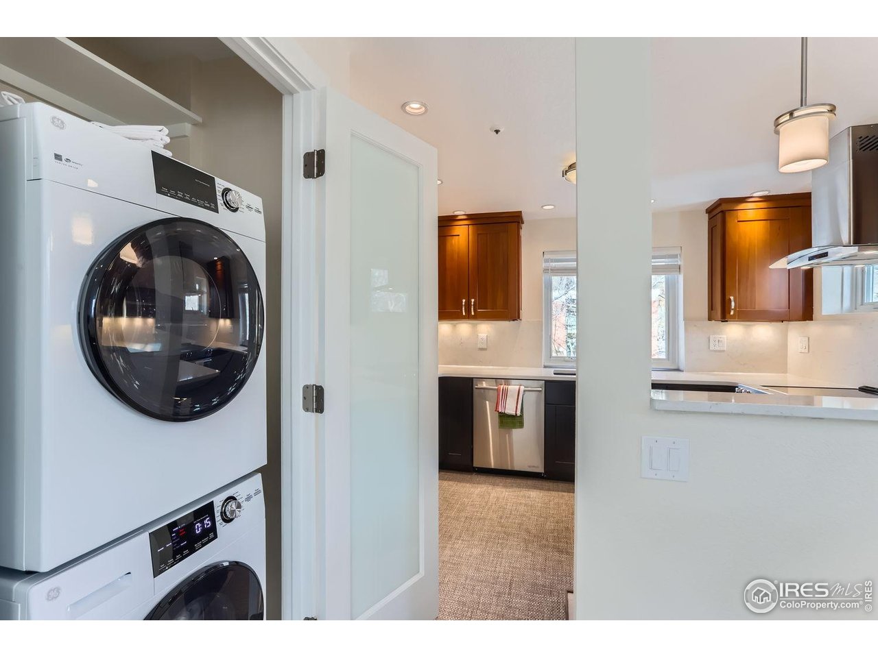 620 Pearl Street, Unit E Boulder, CO 80302 - Photo 20 of 37 a view of a kitchen with stainless steel appliances granite countertop a stove and a sink