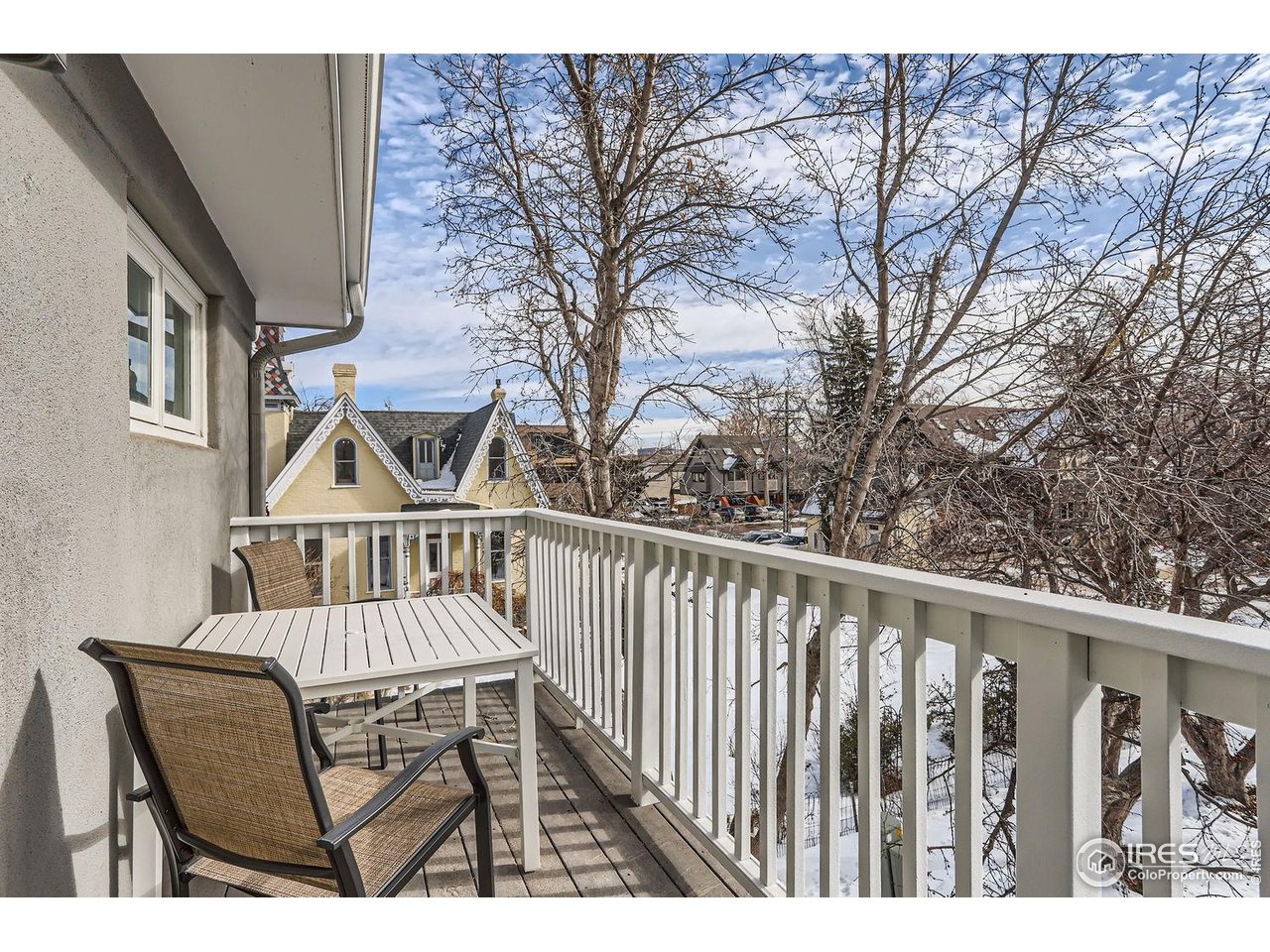 620 Pearl Street, Unit E Boulder, CO 80302 - Photo 21 of 37 a view of balcony with wooden floor and fence