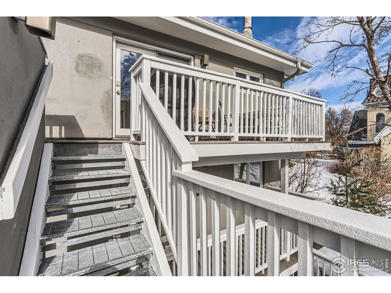 620 Pearl Street, Unit E Boulder, CO 80302 - Photo 22 of 37 a view of balcony with wooden floor and fence