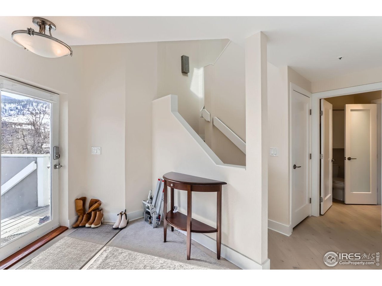 620 Pearl Street, Unit E Boulder, CO 80302 - Photo 3 of 37 a view of a livingroom with furniture and a window