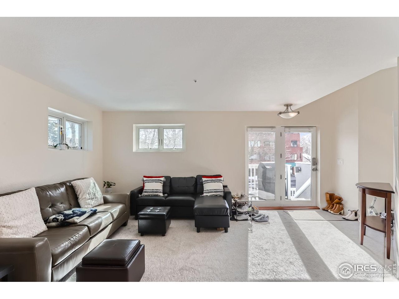 620 Pearl Street, Unit E Boulder, CO 80302 - Photo 4 of 37 a living room with furniture and a flat screen tv