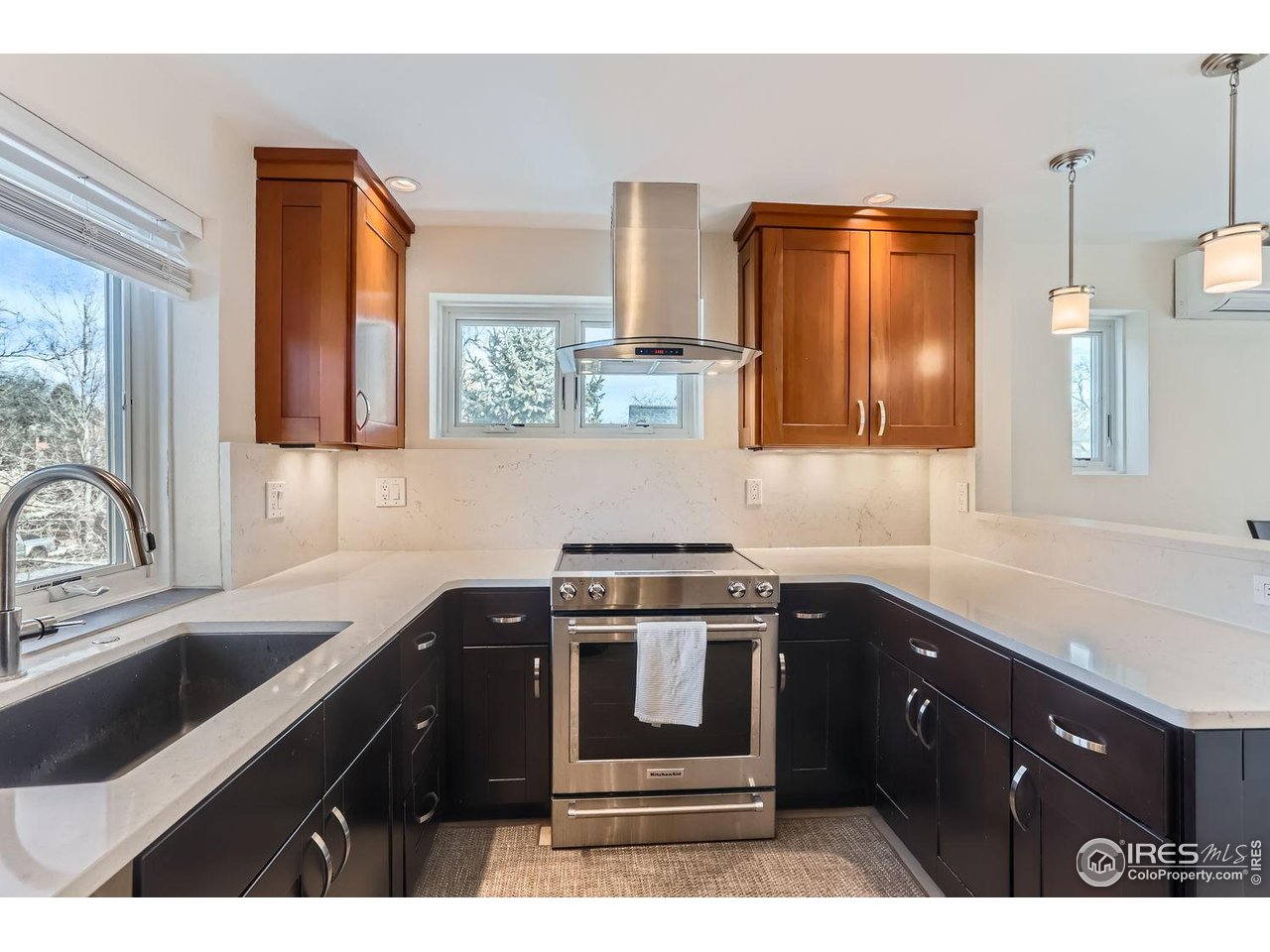 620 Pearl Street, Unit E Boulder, CO 80302 - Photo 6 of 37 a kitchen with a sink stove and microwave