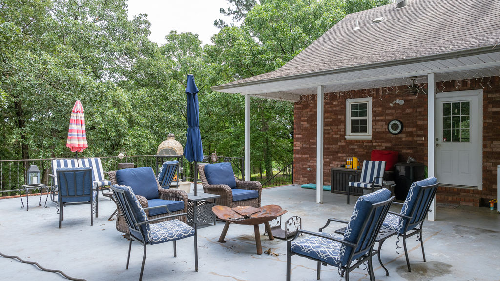 365 Calihan Road Booneville, AR 72927 - Photo 11 of 59 Spacious outdoor patio featuring a concrete surface and a metal railing