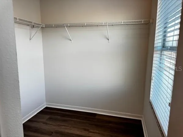 a view of an empty walk in closet