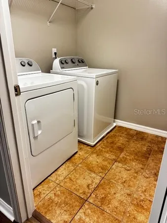 a utility room with dryer and washer