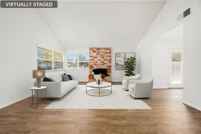 a living room with furniture and a fireplace