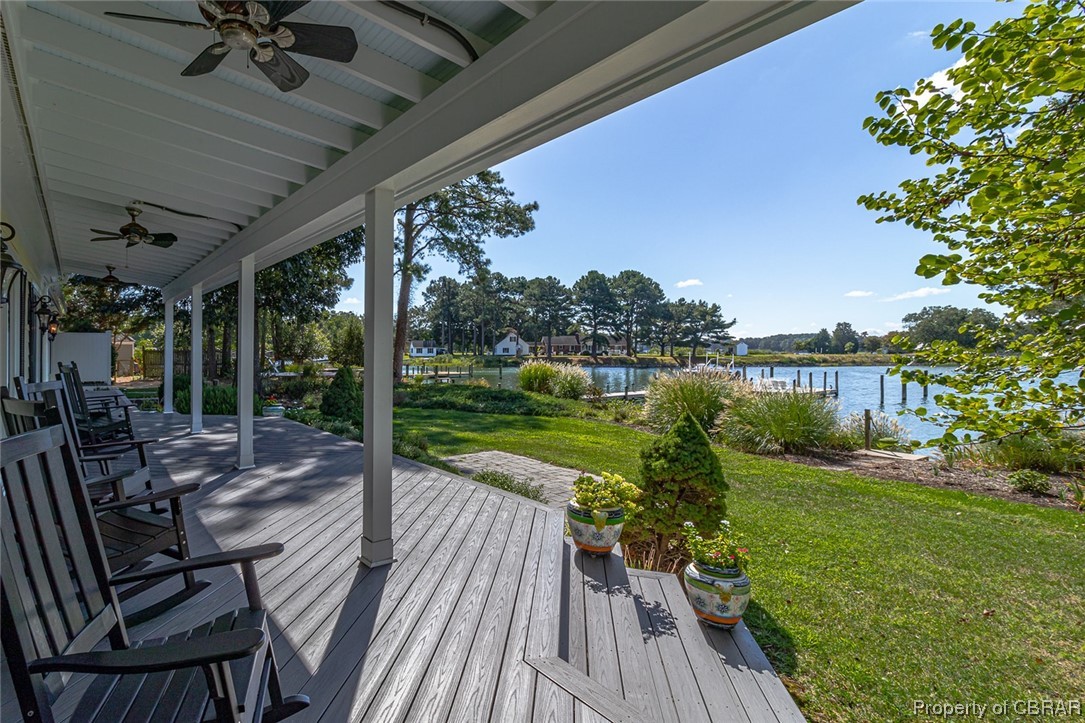 192 Bayberry Point Lane Kilmarnock, VA 22482 - Photo 13 of 49 Wooden terrace featuring a lawn, a water view, and ceiling fan