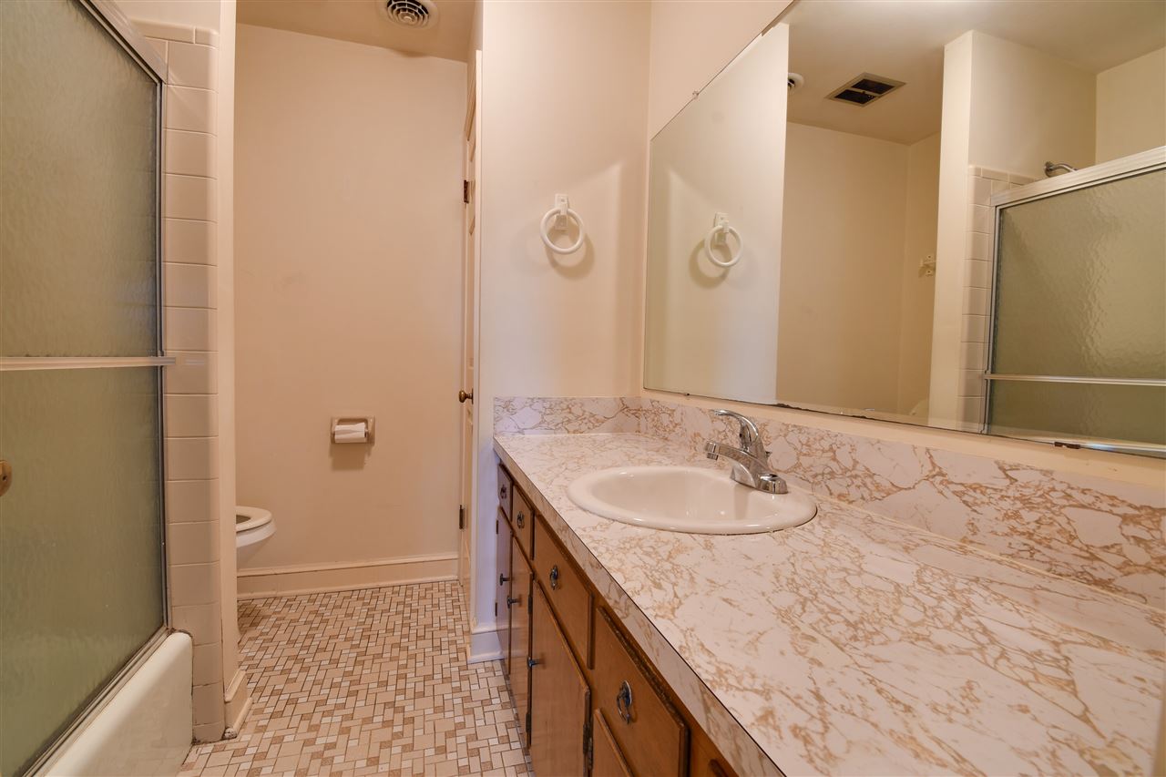 2041 Barterbrook Road Staunton, VA 24401 - Photo 11 of 30 a bathroom with a granite countertop sink and a mirror