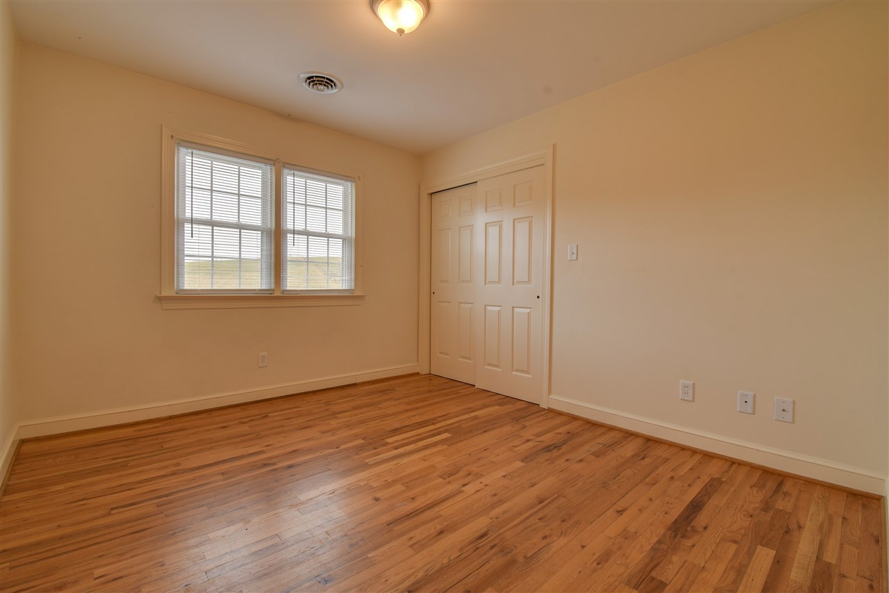 2041 Barterbrook Road Staunton, VA 24401 - Photo 12 of 30 an empty room with wooden floor and windows