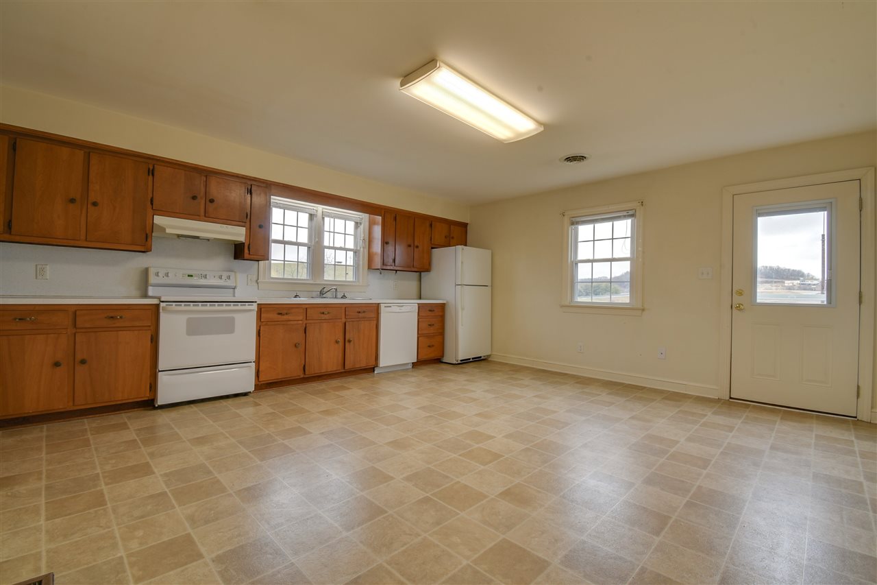 2041 Barterbrook Road Staunton, VA 24401 - Photo 7 of 30 a view of a kitchen with a stove cabinets and a living room