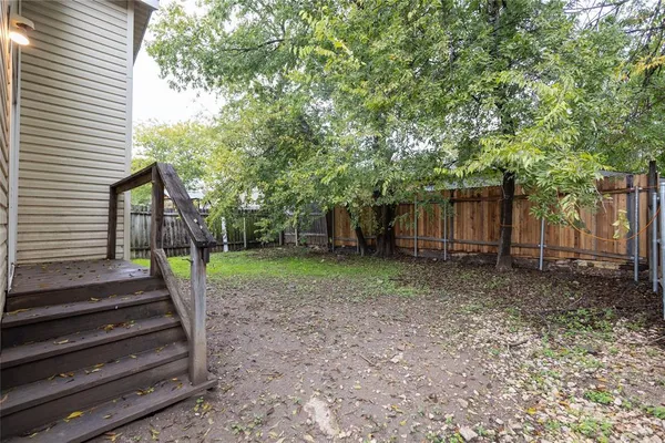 a view of a backyard with trees