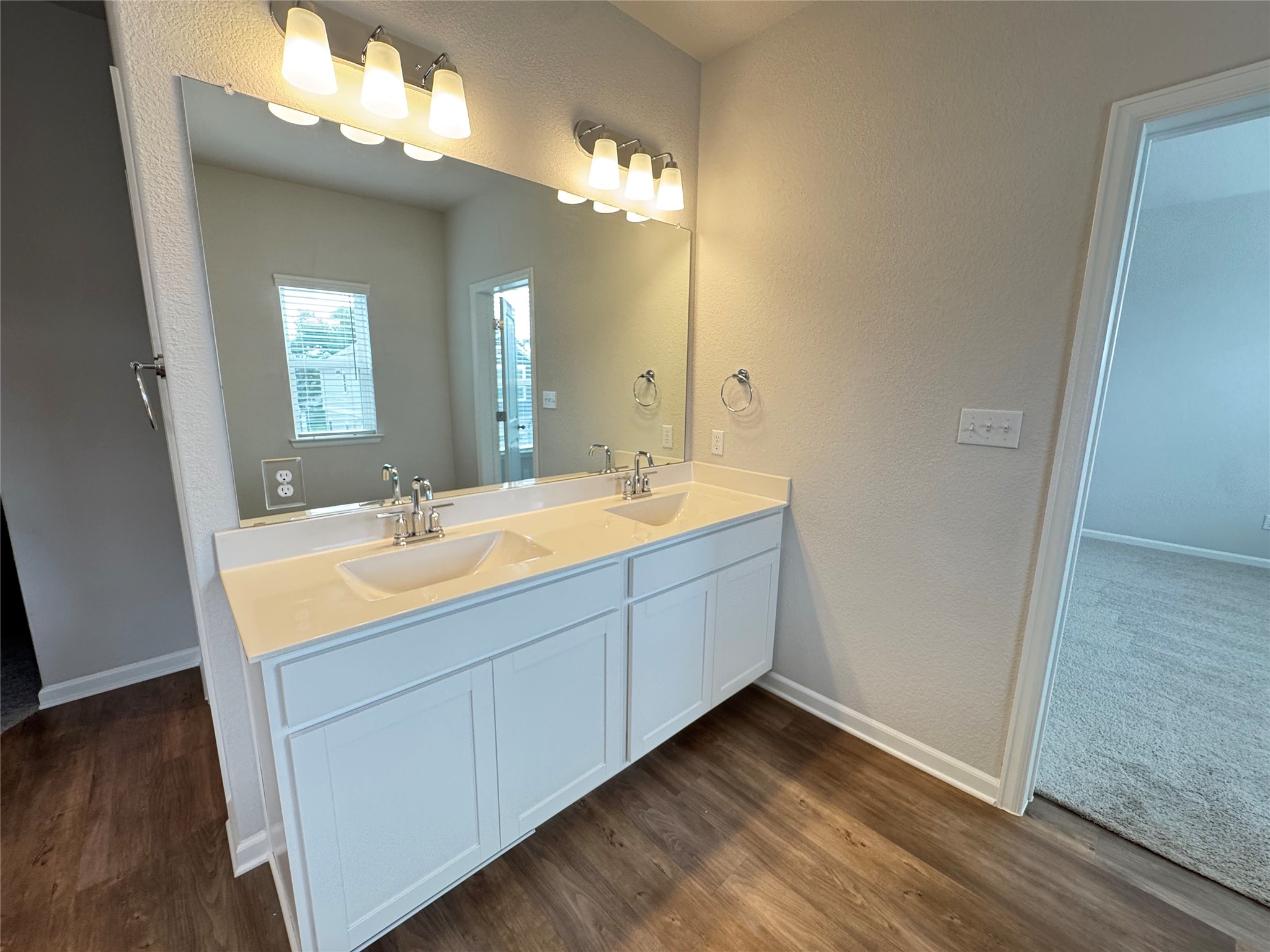 3000 Chisholm Trail Road, Unit 3 Round Rock, TX 78681 - Photo 17 of 28 a bathroom with a double vanity sink and a mirror