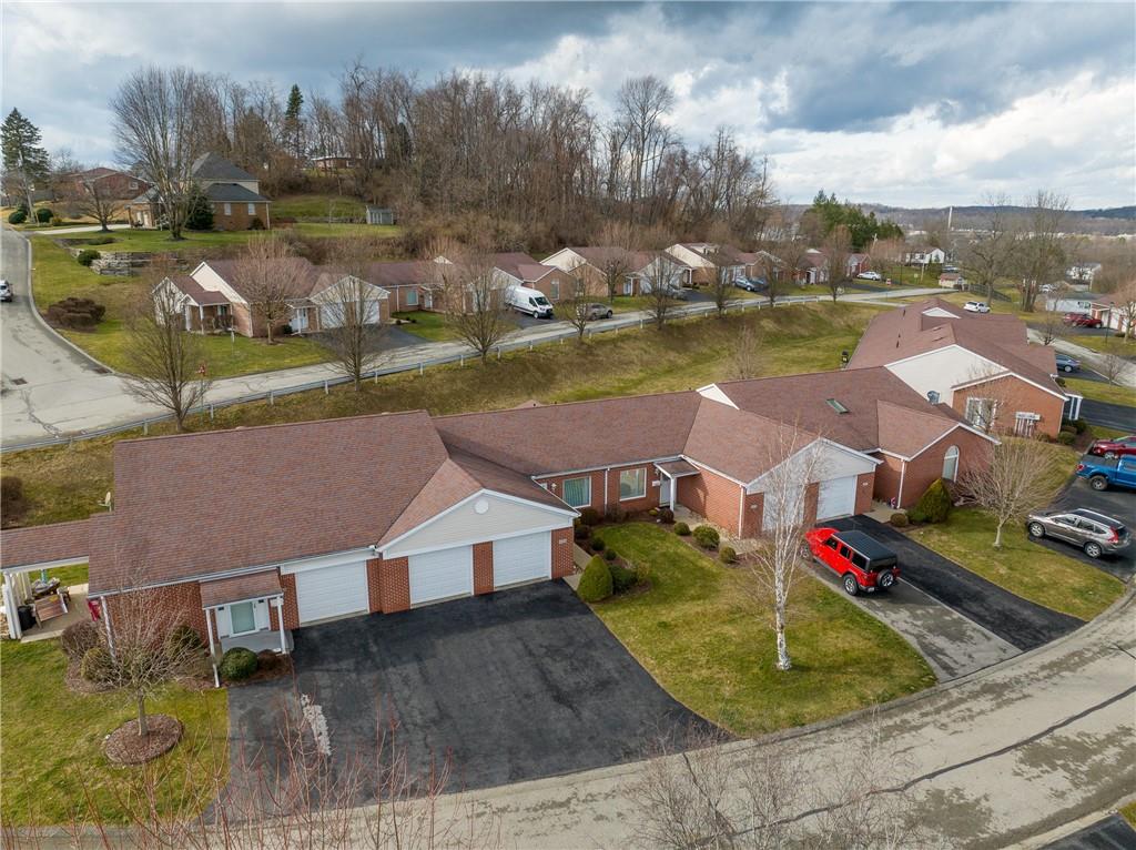 1468 Spring Crest Circle Latrobe, PA 15650 - Photo 27 of 30 an aerial view of residential houses with outdoor space and swimming pool