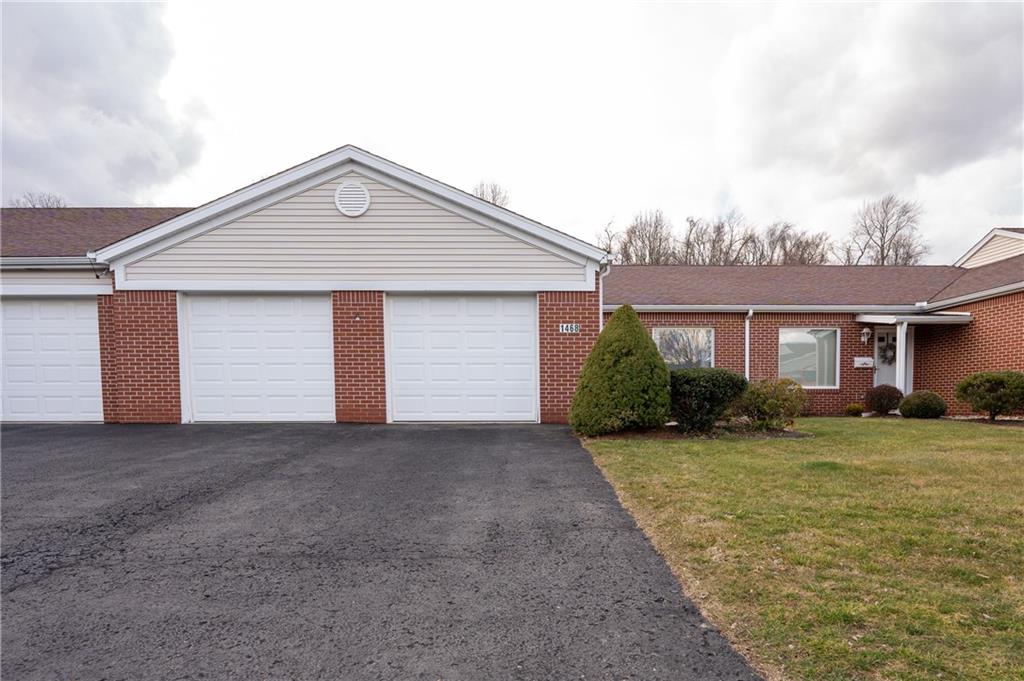1468 Spring Crest Circle Latrobe, PA 15650 - Photo 3 of 30 a view of a house with a yard and garage