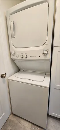 a living room with furniture and a book shelf