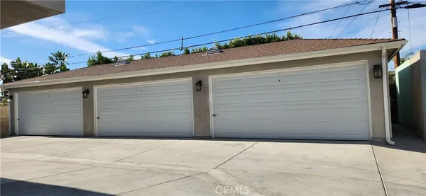 a living room with furniture a rug and a large window