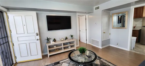 a kitchen with sink a stove and cabinets