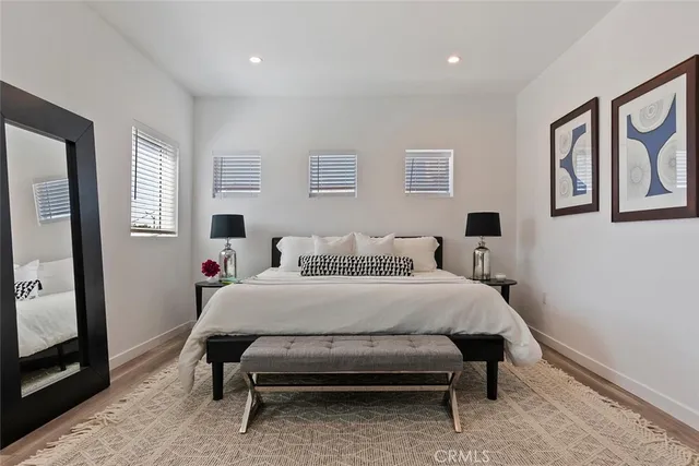 a bed room with a bed and a tv