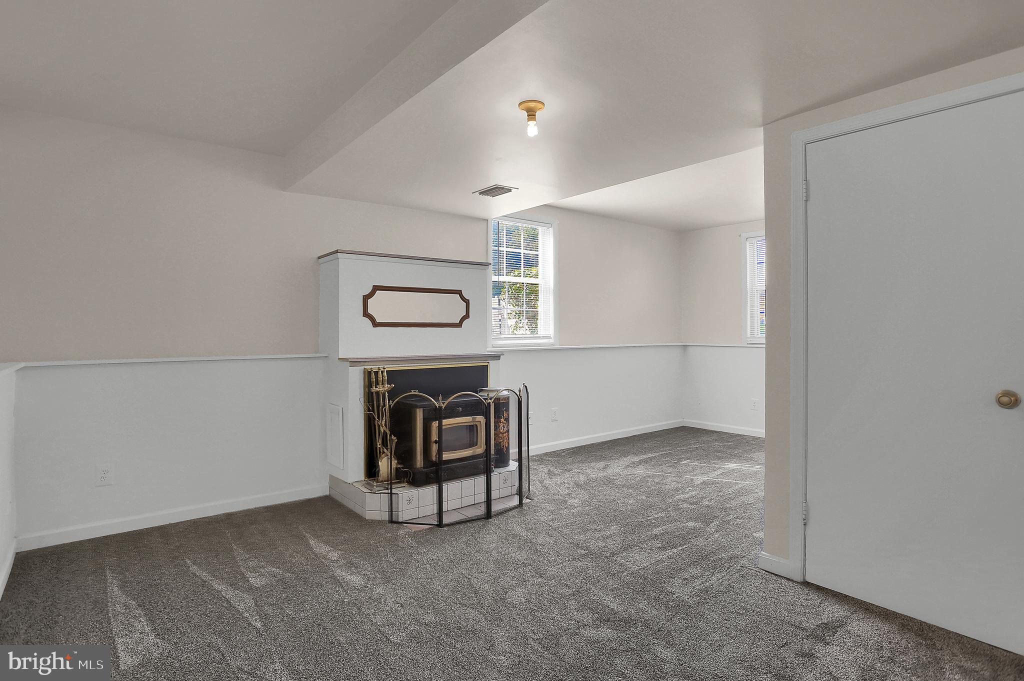 12945 Cunninghill Cove Road Baltimore, MD 21220 - Photo 25 of 35 Family room with pellet stove