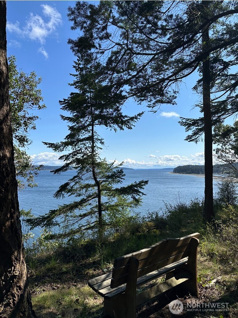 a view of a balcony with chairs and a fire pit