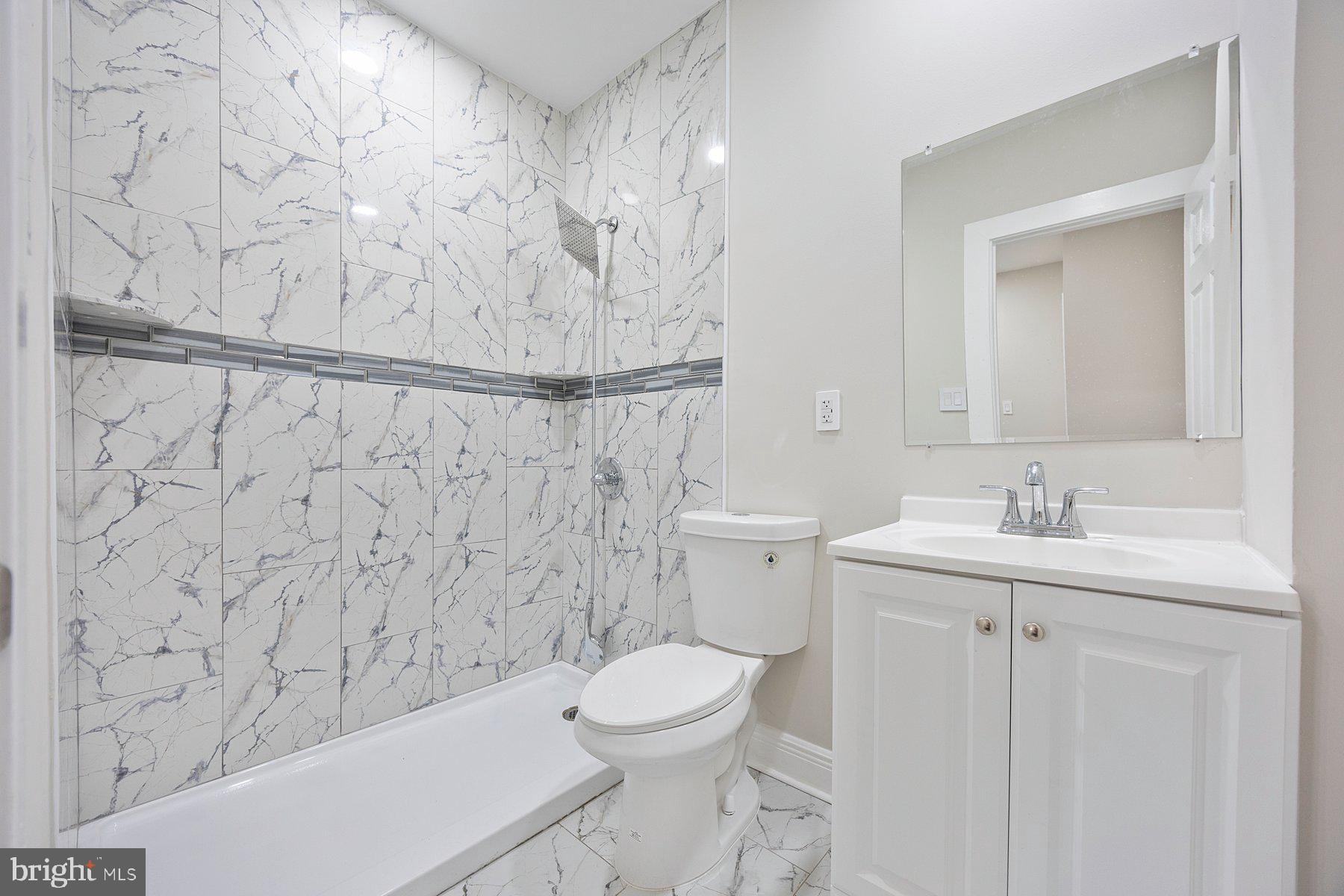 117 Collins Avenue Baltimore, MD 21229 - Photo 21 of 27 a bathroom with a sink a toilet and a bathtub