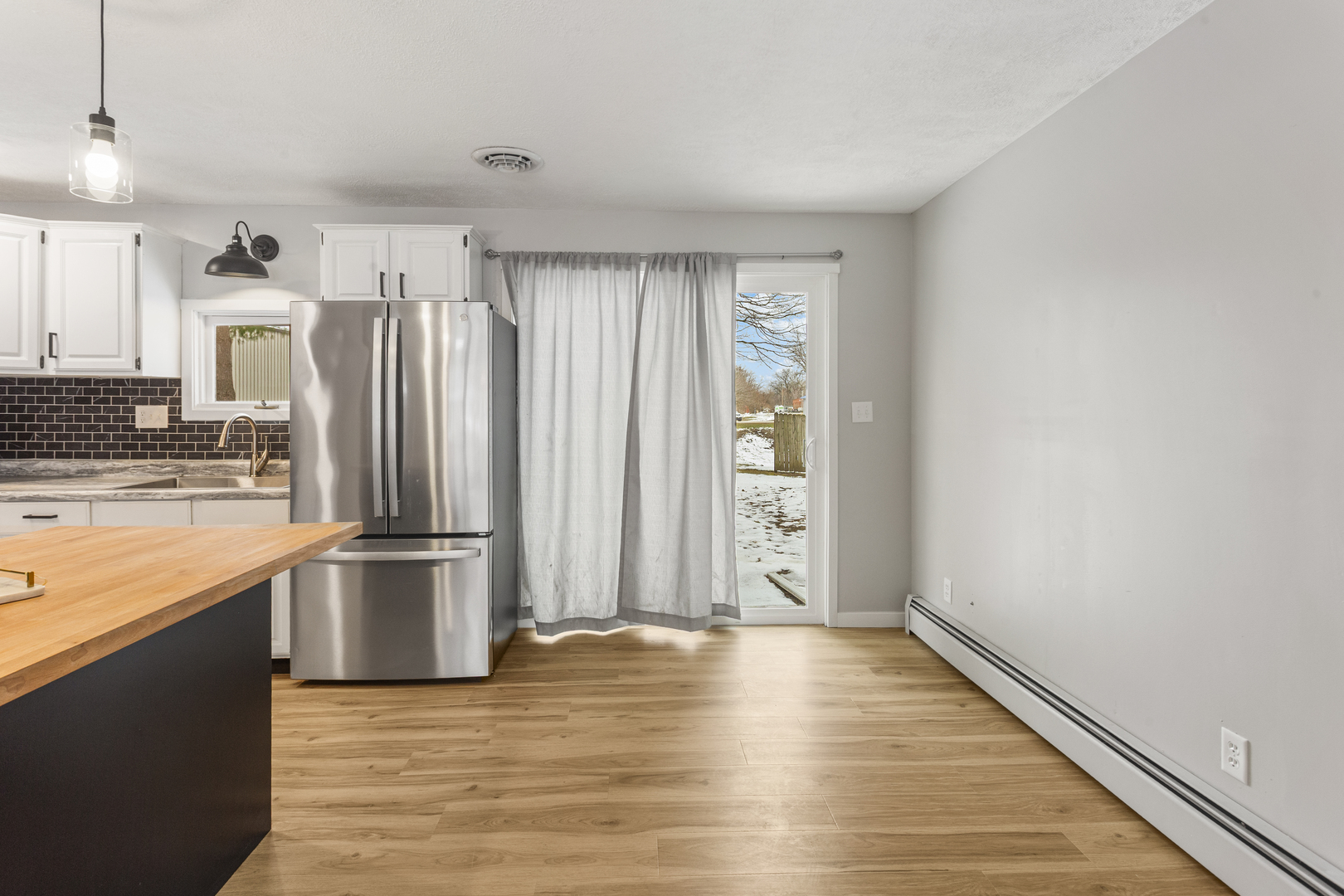 402 South Washington Street Saybrook, IL 61770 - Photo 13 of 24 a view of kitchen with wooden floor electronic appliances and window