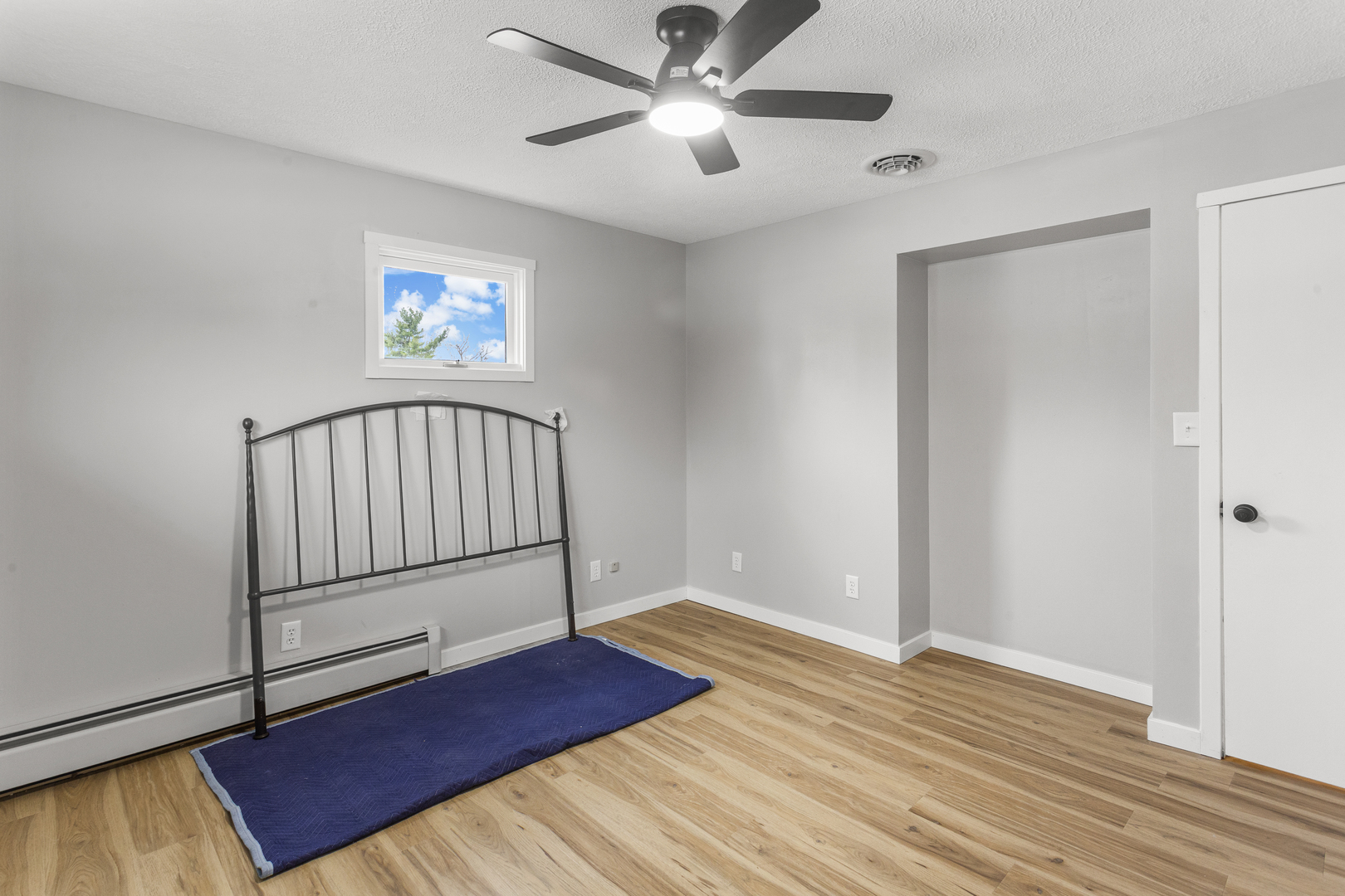 402 South Washington Street Saybrook, IL 61770 - Photo 22 of 24 a view of a livingroom with wooden floor and a ceiling fan