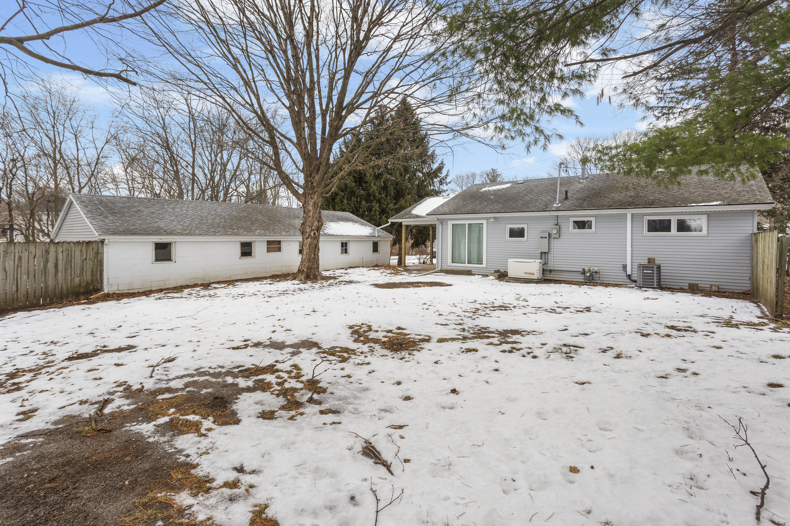 402 South Washington Street Saybrook, IL 61770 - Photo 6 of 24 a front view of a house with a yard covered in snow