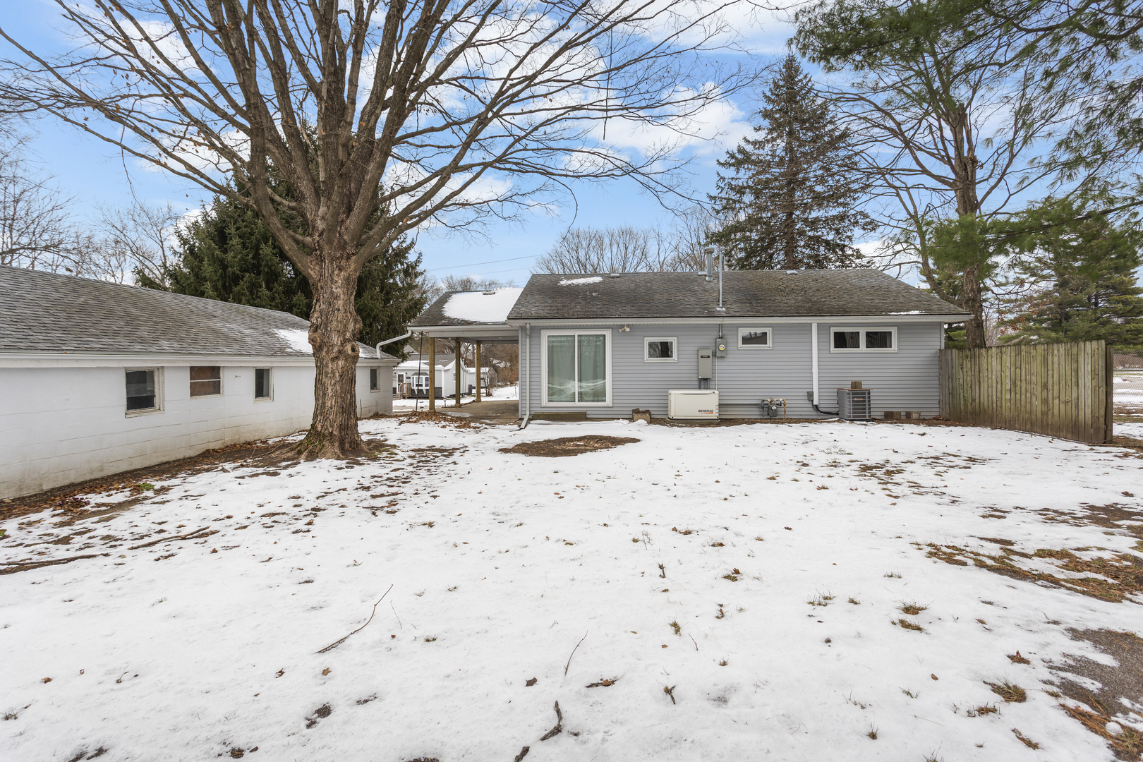 402 South Washington Street Saybrook, IL 61770 - Photo 7 of 24 a front view of a house with a yard covered in snow