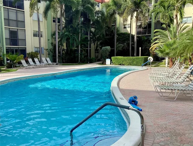 a view of a swimming pool with a patio