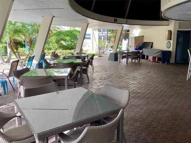 a view of an outdoor dining space with furniture