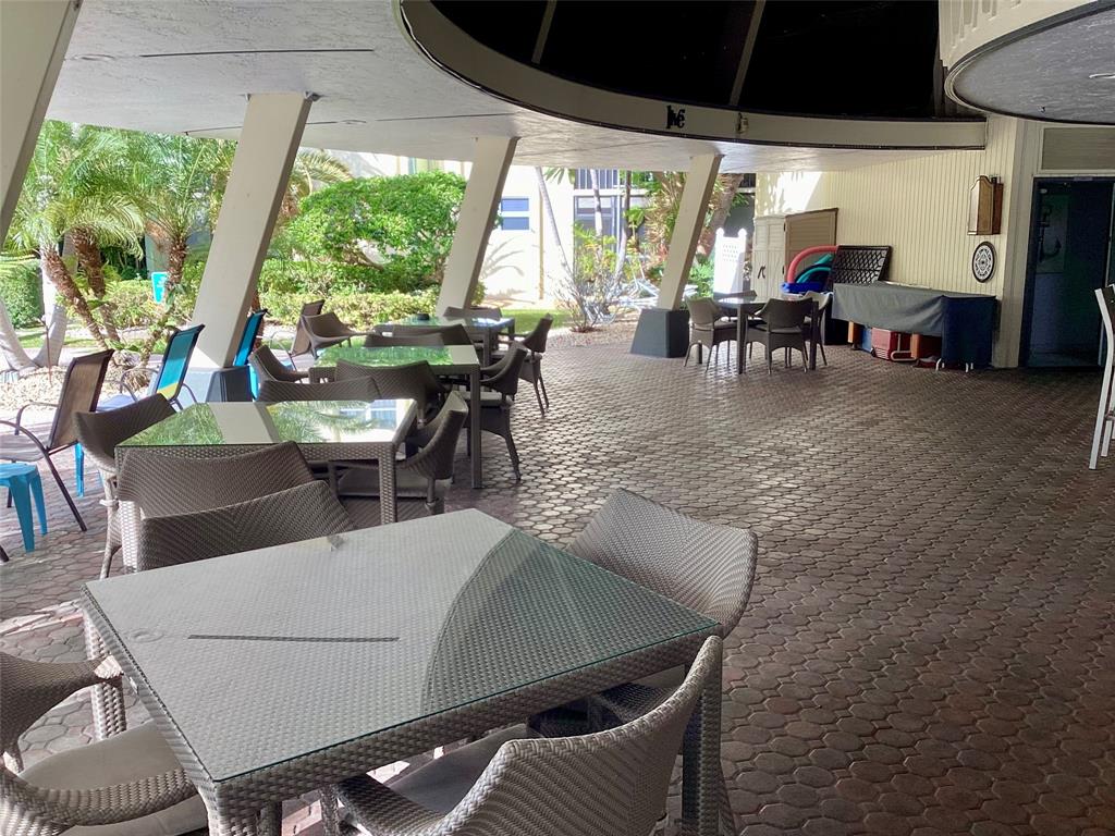 5300 Northeast 24th Terrace, Unit 416C Fort Lauderdale, FL 33308 - Photo 19 of 26 a view of an outdoor dining space with furniture