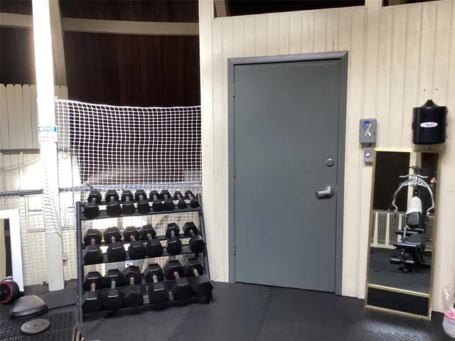 a view of a street with a building in the background